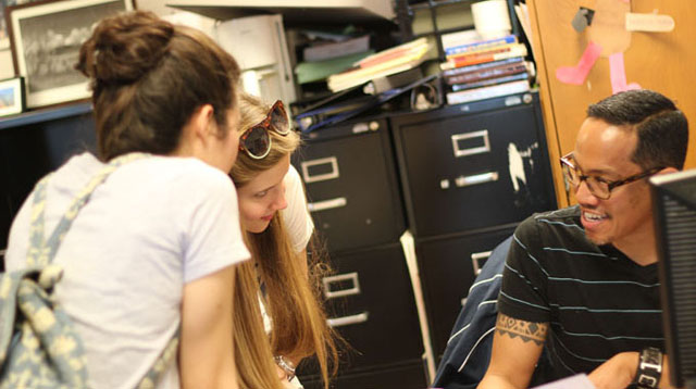 Class of 2011 alumni Kasia Gawlas and Karina Fathi speak with English teacher Robert Javier on June 9, the day of graduation. Gawlas, an administrator of the Facebook group “Save Robert Javier and Debbie Vanni!”, helped coordinate students’ dissenting response to the transfers. Photo by Kevin Tsukii.