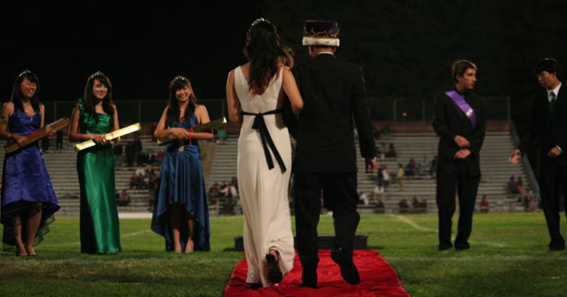 Class of 2011 Homecoming Court members Elaine Tang, Brianna Zimmers, Angeline Chen, Timur Mertol and Jordan Lim wait as the rest of the court arrives onto the Cupertino High School football field. This year’s Homecoming King and Queen will be announced during halftime at the Oct. 14 Homecoming football game at Fremont High School. Photo by Kevin Tsukii.