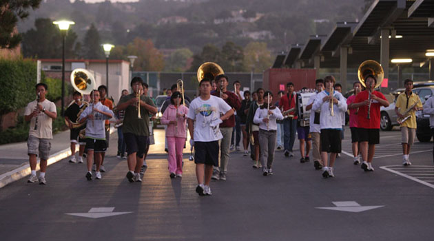 Marching Band rehearses on Oct. 25 in the student parking lot; rehearsals are held on Tuesday evenings for three hours and Saturdays from 9 a.m. to 5 p.m. The group will compete on Nov. 12 in the Napa Valley Vintage Band Review and will end their season on Nov. 19 at the 57th Arcadia Invitational Band Review. Photo by Kevin Tsukii.